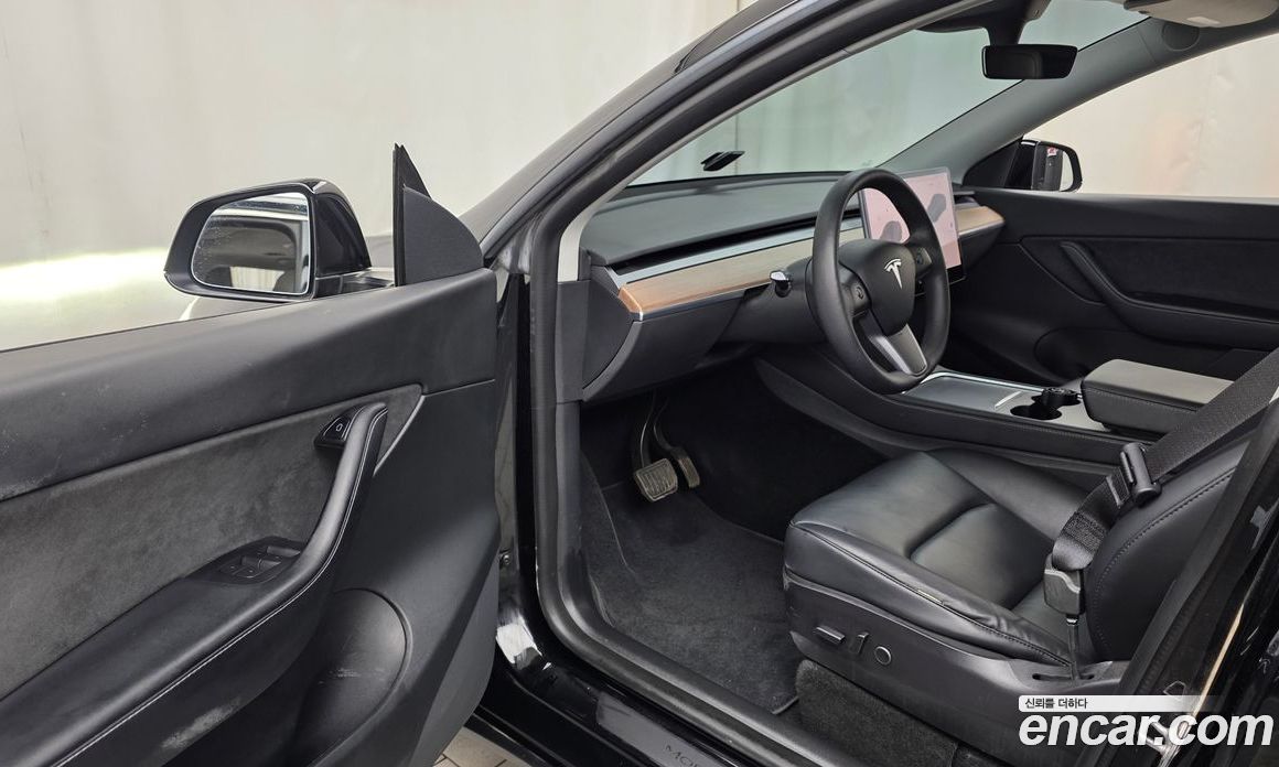 Tesla Model Y фото 10