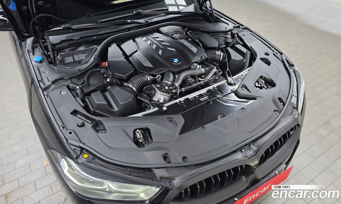 BMW 8-Series (G15) фото 6