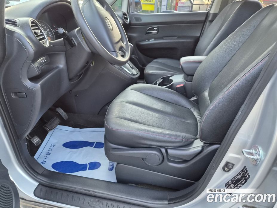 Kia Carens 2nd Gen фото 13