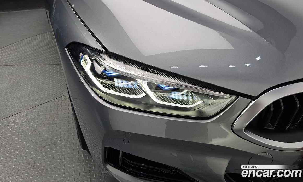 BMW 8-Series (G15) фото 22